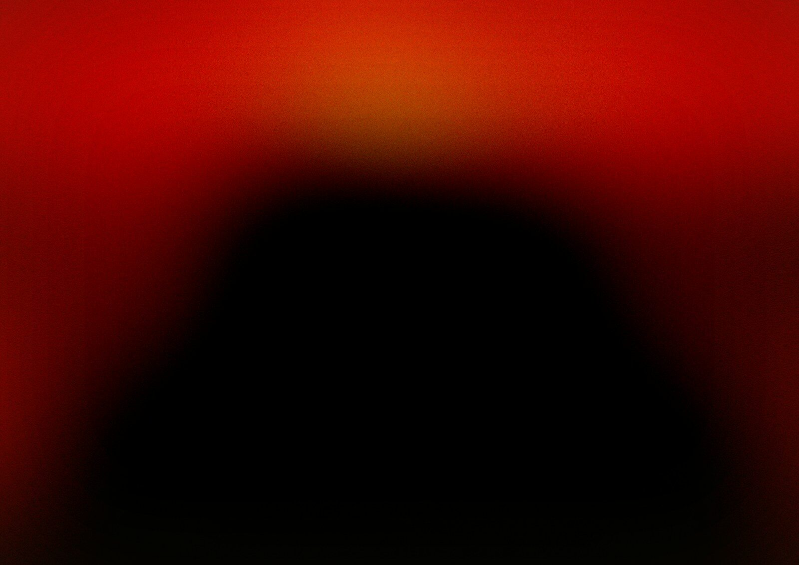 Abstract dark shape against a red and orange gradient